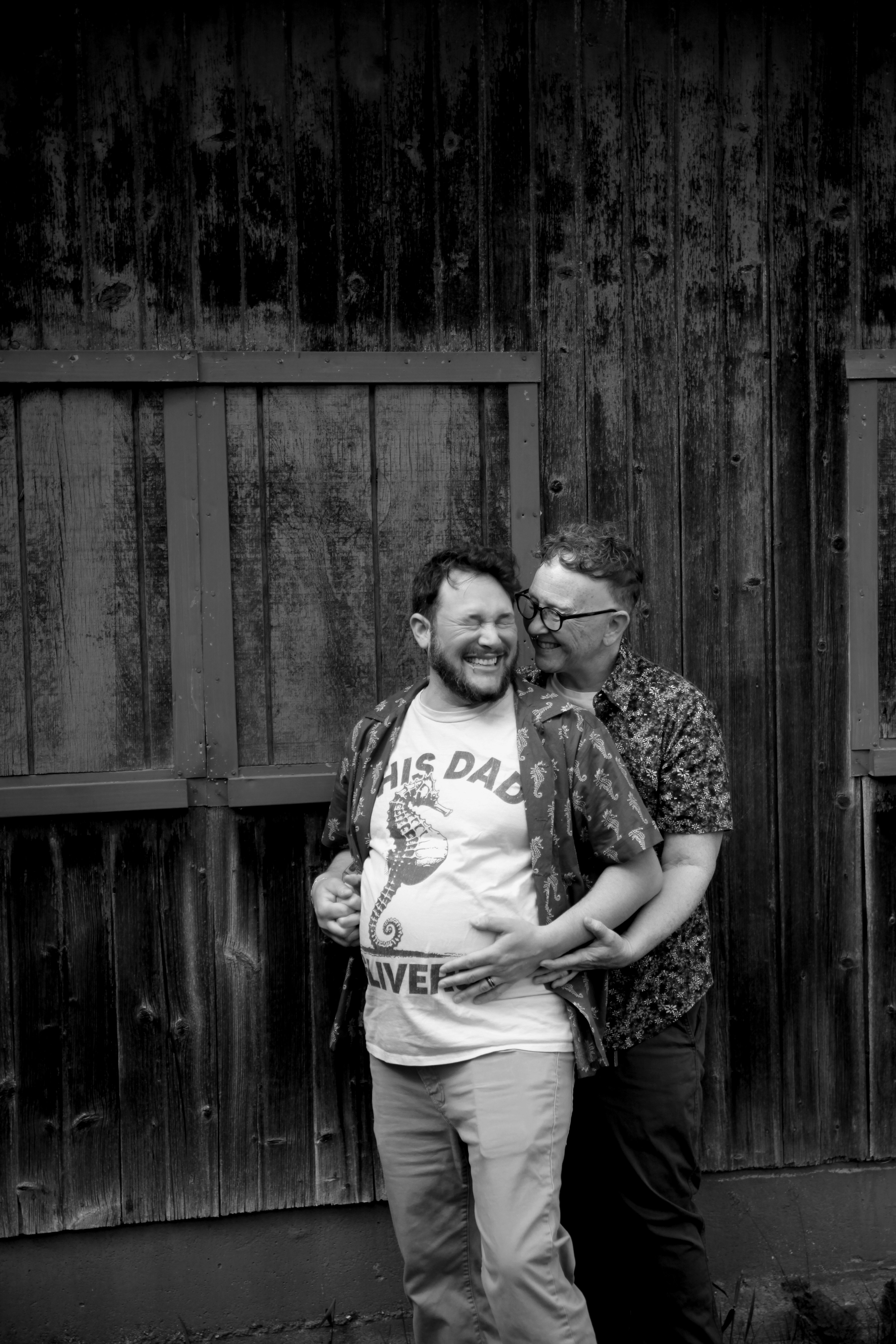 couple in black and white picture smiling 